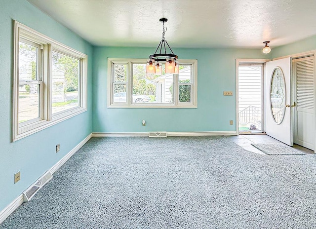 2201 6th Ave N, Great Falls, MT 59401 - foyer entrance featuring carpet floors, baseboards, and a textured ceiling