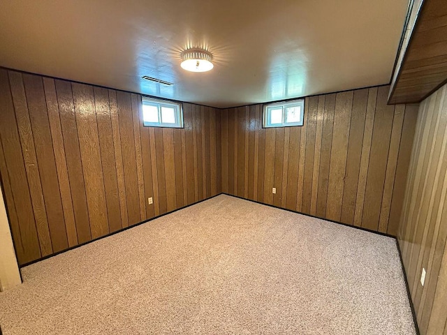 2201 6th Ave N, Great Falls, MT 59401 - basement with wooden walls, plenty of natural light, and carpet floors