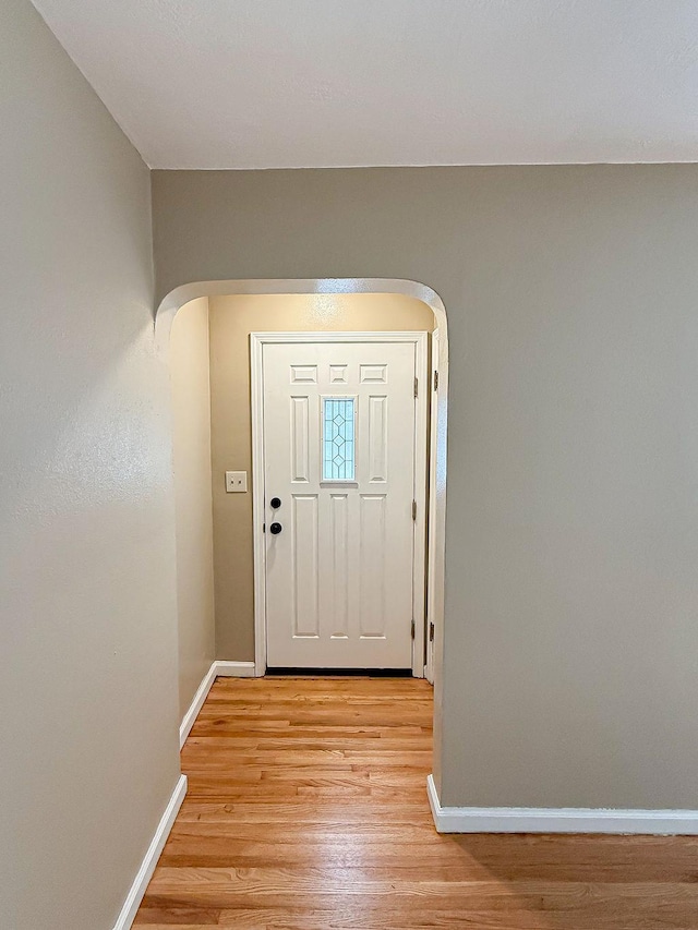2201 6th Ave N, Great Falls, MT 59401 - foyer entrance with arched walkways, light wood finished floors, and baseboards