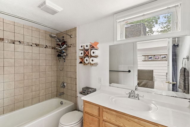 2713 5th Ave S, Great Falls, MT 59405 - bathroom featuring vanity, bathtub / shower combination, toilet, a textured ceiling, and ensuite bathroom