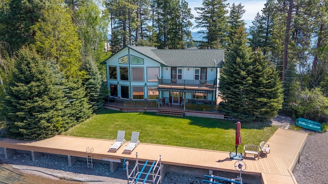 37817 Kings Point Rd, Polson, MT 59860 - rear view of property featuring a deck and a yard