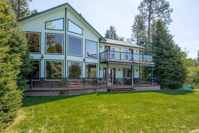 37817 Kings Point Rd, Polson, MT 59860 - rear view of property featuring a lawn, a deck, and a balcony