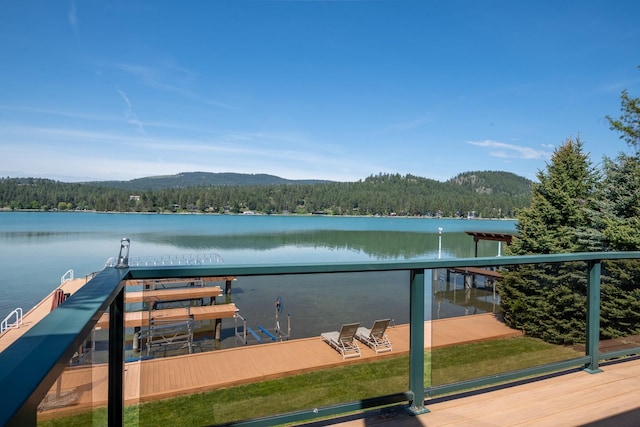 37817 Kings Point Rd, Polson, MT 59860 - dock area featuring a forest view, a water view, and a balcony