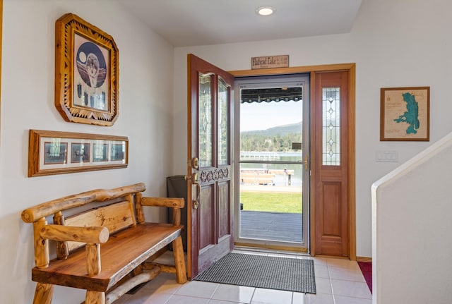 37817 Kings Point Rd, Polson, MT 59860 - entryway with light tile patterned flooring, recessed lighting, and baseboards