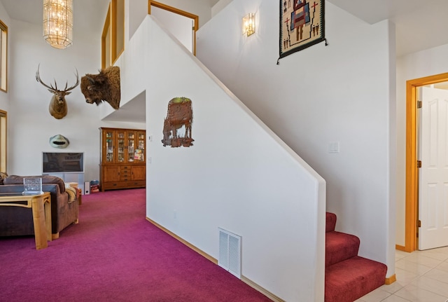 37817 Kings Point Rd, Polson, MT 59860 - stairs featuring carpet floors, baseboards, and a chandelier