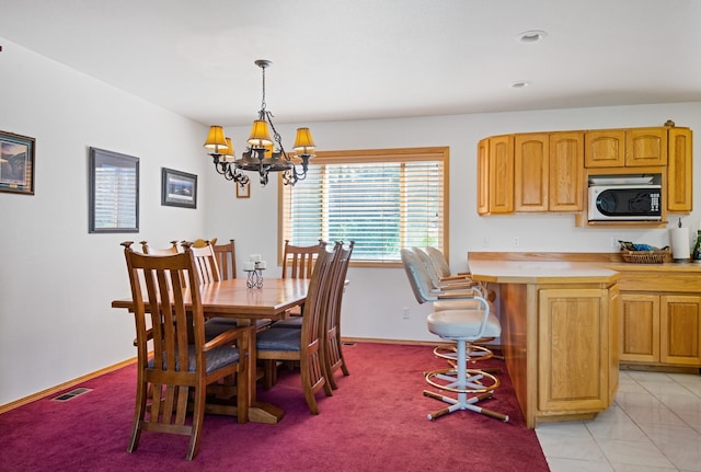 37817 Kings Point Rd, Polson, MT 59860 - dining space with a chandelier, baseboards, and light carpet