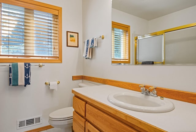 37817 Kings Point Rd, Polson, MT 59860 - full bath with toilet, vanity, and a shower with shower door
