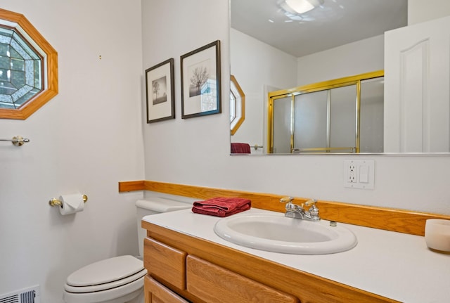 37817 Kings Point Rd, Polson, MT 59860 - full bath featuring toilet, vanity, and a shower with door