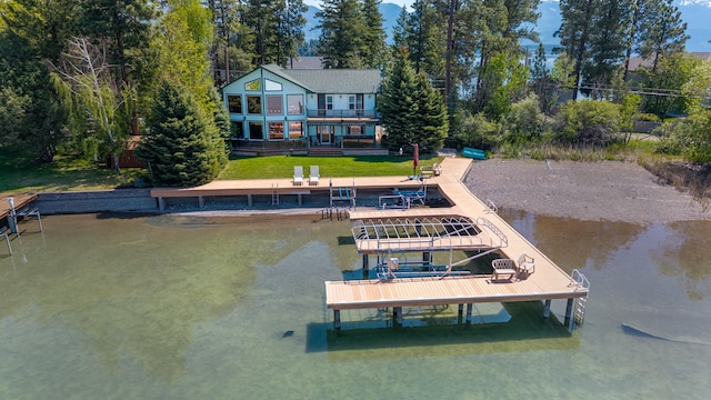 37817 Kings Point Rd, Polson, MT 59860 - dock featuring boat lift, a water view, and a balcony