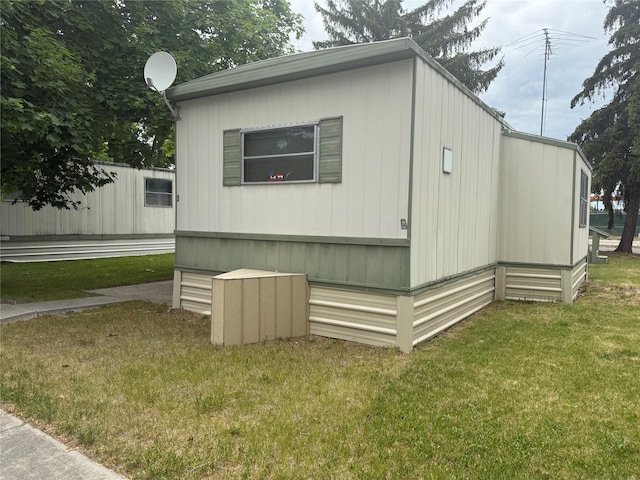 10011 Bitterroot Gtwy Unit 3, Lolo, MT 59847 - view of property exterior with a lawn