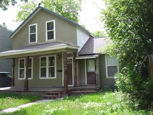 619 E Broadway St, Helena, MT 59601 - view of front of property featuring stucco siding, roof with shingles, and covered porch