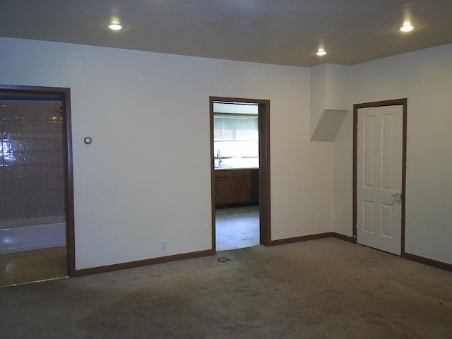 619 E Broadway St, Helena, MT 59601 - carpeted spare room with a sink, baseboards, and recessed lighting