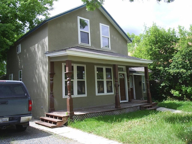 619 E Broadway St, Helena, MT 59601 - view of front of home featuring a porch and stucco siding