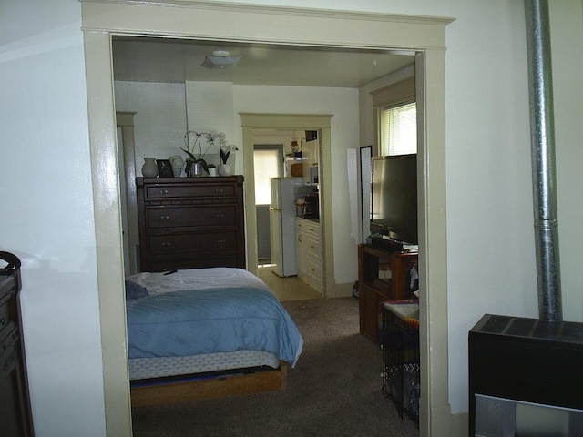 619 E Broadway St, Helena, MT 59601 - bedroom with carpet, freestanding refrigerator, and multiple windows
