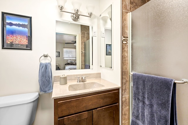 122 22nd St S, Great Falls, MT 59401 - ensuite bathroom featuring vanity, toilet, and a shower with door