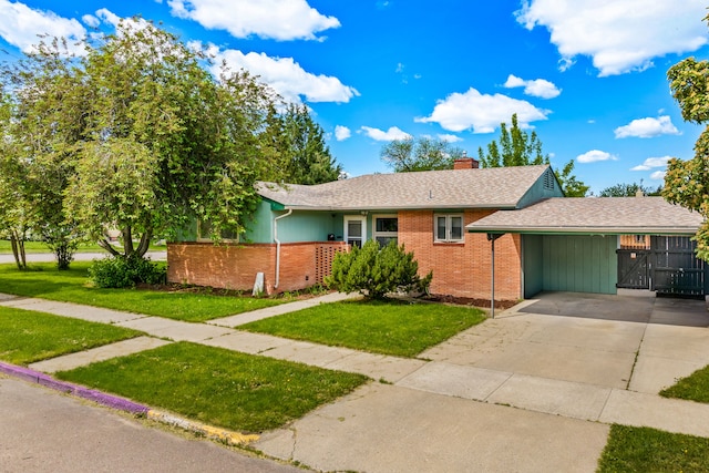 122 22nd St S, Great Falls, MT 59401 - single story home with brick siding, driveway, a chimney, a carport, and a shingled roof