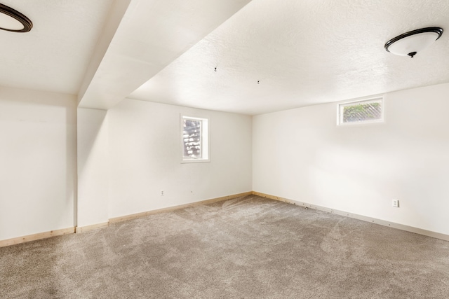 122 22nd St S, Great Falls, MT 59401 - bonus room with carpet floors, plenty of natural light, baseboards, and a textured ceiling