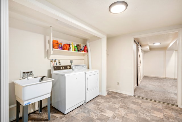 122 22nd St S, Great Falls, MT 59401 - laundry area featuring washer and dryer, baseboards, and stone finish flooring