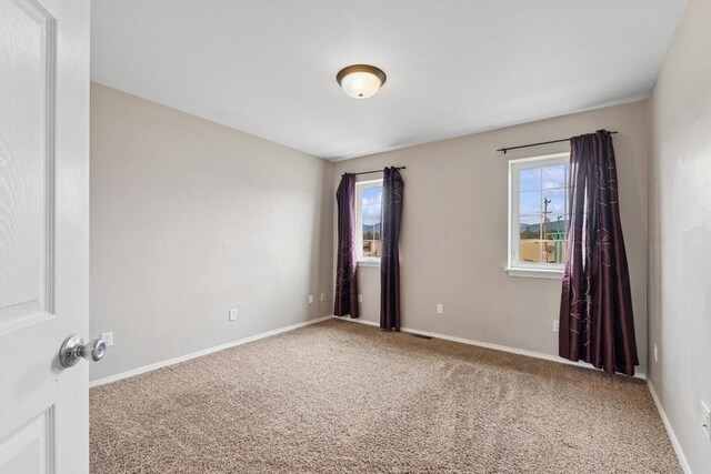 8 Mitchell Way, Columbia Falls, MT 59912 - spare room with carpet flooring and baseboards