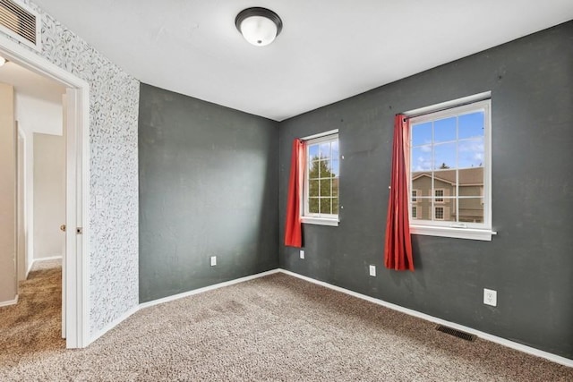 8 Mitchell Way, Columbia Falls, MT 59912 - unfurnished living room featuring wood finished floors, a wall mounted air conditioner, and baseboards
