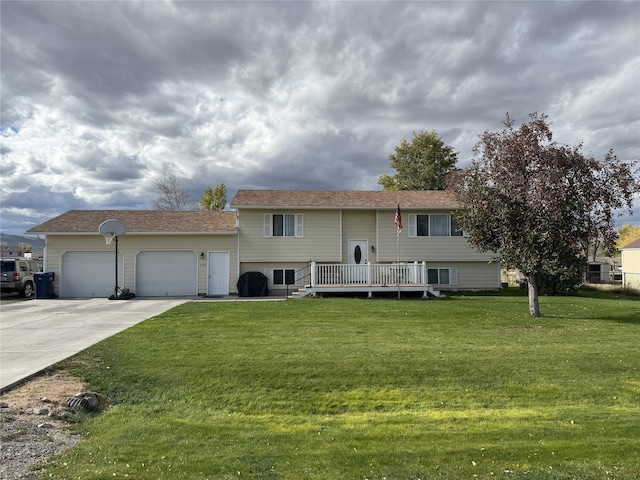 2720 Bandera Dr, East Helena, MT 59635 - bi-level home with a garage, a front lawn, driveway, and a wooden deck