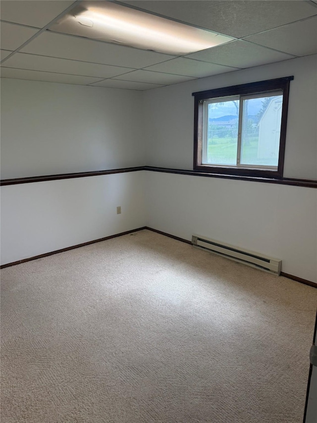 2720 Bandera Dr, East Helena, MT 59635 - carpeted spare room featuring baseboard heating, a drop ceiling, and baseboards