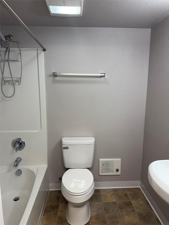2720 Bandera Dr, East Helena, MT 59635 - full bath featuring toilet, baseboards, and bathing tub / shower combination