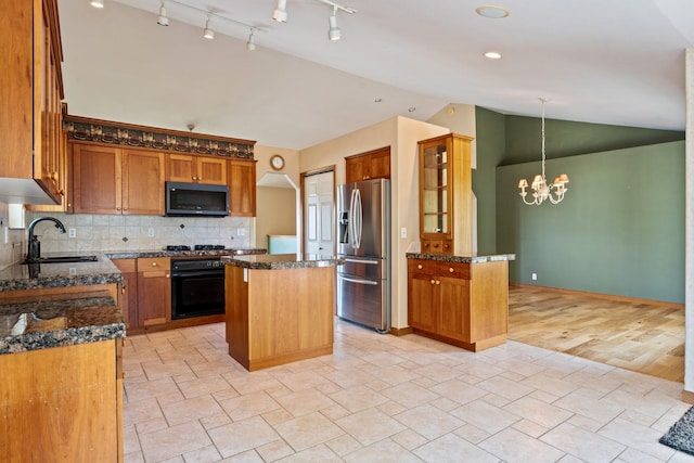 3721 Brandon Way, Missoula, MT 59803 - kitchen featuring black appliances, a sink, a kitchen island, vaulted ceiling, and a chandelier