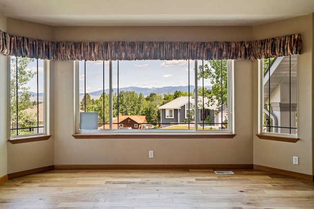 3721 Brandon Way, Missoula, MT 59803 - empty room with plenty of natural light, baseboards, and wood finished floors