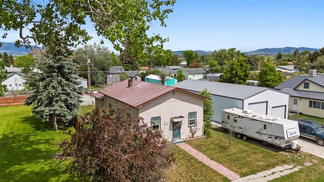 305 S Cedar St, Townsend, MT 59644 - aerial view of residential area with a mountainous background