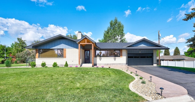 2 N Oregon St, Helena, MT 59601 - ranch-style house featuring brick siding, an attached garage, driveway, and a chimney