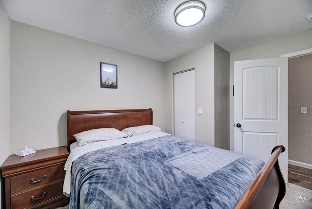 2 N Oregon St, Helena, MT 59601 - bedroom featuring wood finished floors, a textured ceiling, baseboards, and a textured wall