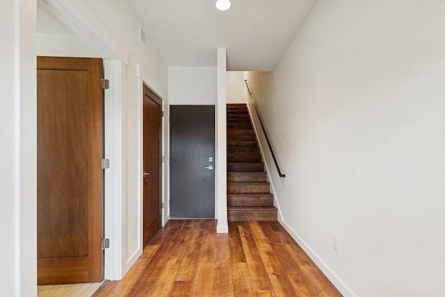147 Hawthorne Ct Unit B, Whitefish, MT 59937 - staircase featuring wood finished floors and baseboards