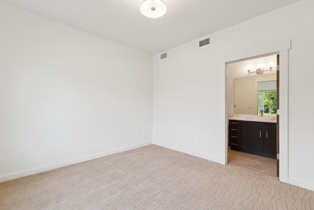 147 Hawthorne Ct Unit B, Whitefish, MT 59937 - empty room featuring baseboards and light carpet
