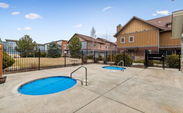 147 Hawthorne Ct Unit B, Whitefish, MT 59937 - view of swimming pool featuring a patio area and a residential view