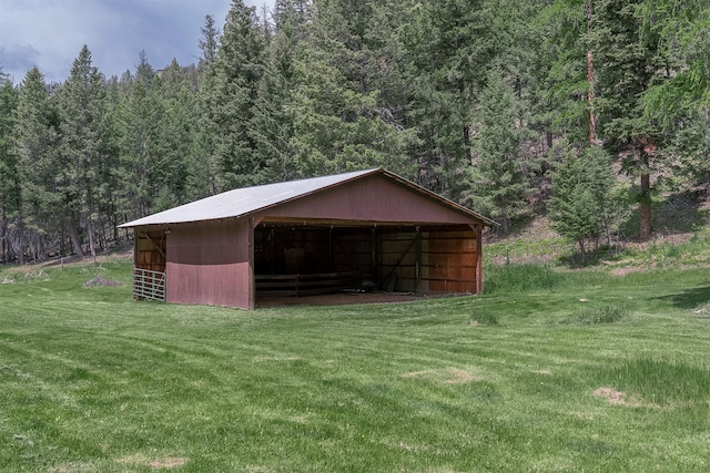 1835 Emmons Canyon Rd, Kila, MT 59920 - view of pole building featuring a view of trees, a yard, and an exterior structure