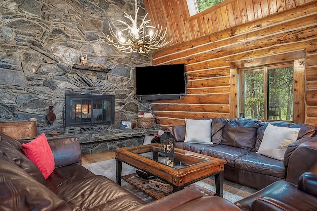 1835 Emmons Canyon Rd, Kila, MT 59920 - living area featuring healthy amount of natural light, log walls, a chandelier, wood finished floors, and a high ceiling