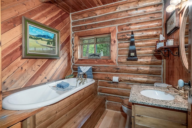 1835 Emmons Canyon Rd, Kila, MT 59920 - bathroom featuring a bath, log walls, vanity, wood ceiling, and wood-type flooring