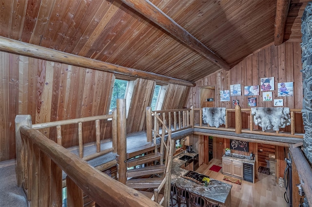 1835 Emmons Canyon Rd, Kila, MT 59920 - misc room featuring an upstairs landing, wood ceiling, wooden walls, and wood finished floors