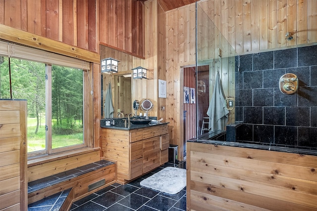 1835 Emmons Canyon Rd, Kila, MT 59920 - full bathroom featuring wooden walls, vanity, a shower, and healthy amount of natural light