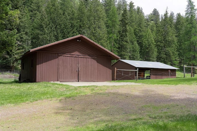 1835 Emmons Canyon Rd, Kila, MT 59920 - view of pole building featuring a forest view and a lawn