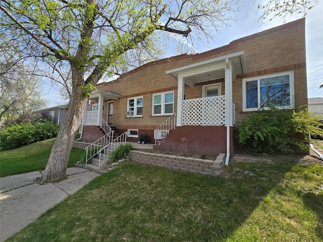 515 7th St N, Great Falls, MT 59401 - view of front of house with a front lawn and brick siding