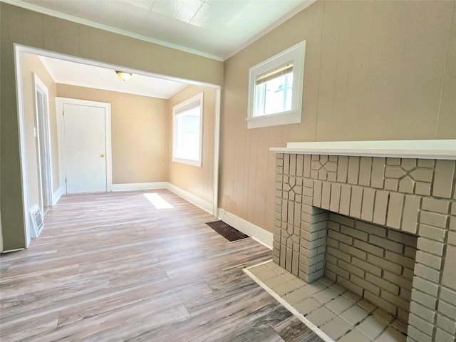 515 7th St N, Great Falls, MT 59401 - unfurnished living room with light wood-style flooring, ornamental molding, and baseboards