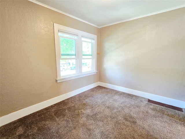 515 7th St N, Great Falls, MT 59401 - carpeted empty room featuring crown molding, baseboards, and a textured wall