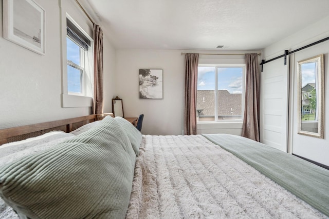 845 Mountain Vista Way, Kalispell, MT 59901 - bedroom featuring a barn door