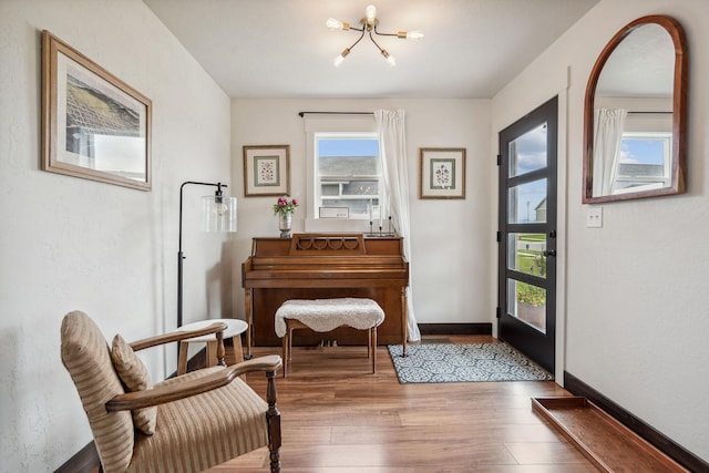 845 Mountain Vista Way, Kalispell, MT 59901 - entrance foyer with a chandelier, wood finished floors, and baseboards