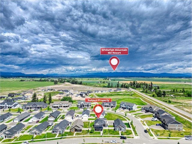 845 Mountain Vista Way, Kalispell, MT 59901 - aerial perspective of suburban area featuring a mountainous background