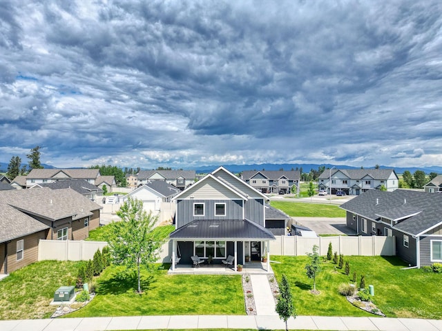 845 Mountain Vista Way, Kalispell, MT 59901 - rear view of house featuring a residential view, a patio, and metal roof