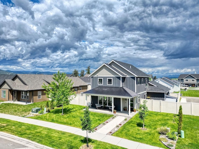 845 Mountain Vista Way, Kalispell, MT 59901 - view of front of home featuring board and batten siding, metal roof, a residential view, and a standing seam roof