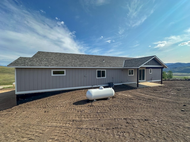 13463 Bunchgrass Ln, Missoula, MT 59808 - rear view of property with a patio area and a mountain view